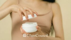 woman opening a can of facial moisturizer 